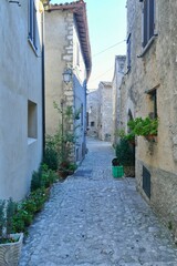 Fototapeta na wymiar A narrow street among the old houses of Fumone, a historic town in the state of Lazio in Italy.