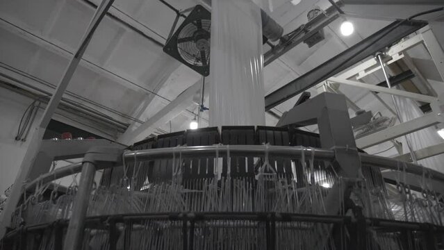 This stock video shows a weaving factory. Matter is produced on the loom. This video will decorate your projects related to weaving, weaving industry, fabric production.