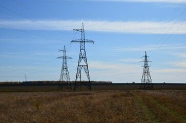 electric pylons on the background of the field