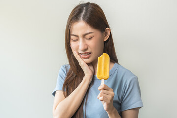 Face expression suffering from sensitive teeth and cold, asian young woman, girl feeling hurt, pain...