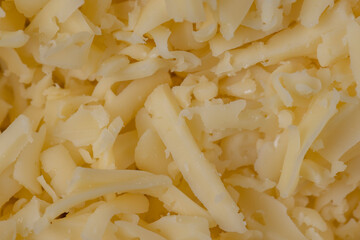 Hard cheese with holes grated into thin small slices