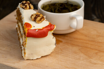 a cut piece of multi-layered honey cake with creamy filling