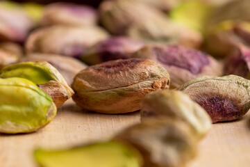Crispy delicious pistachios with salt on the table
