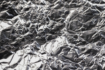 old used crumpled aluminum foil , close up