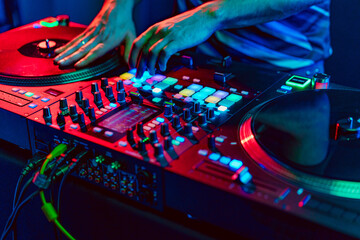 Close up of dj console mixer during concert in the club