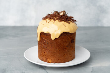 Easter cake with nest decor on gray background