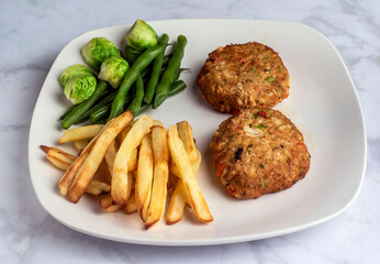 lobster cakes  with green beans and brussel sprouts