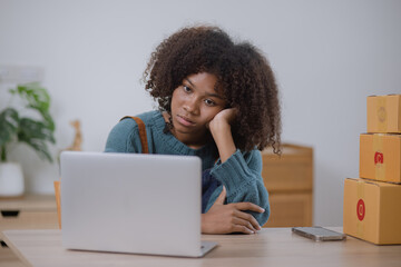 Young African American woman feel stress and upset with bad sell at home office, Concept of small business owner, Business online market delivery, African woman stressed about selling. 