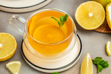 Bergamot tea in transparent cup with fresh bergamot fruit, Clean eating, dieting, vegan food concept. top view