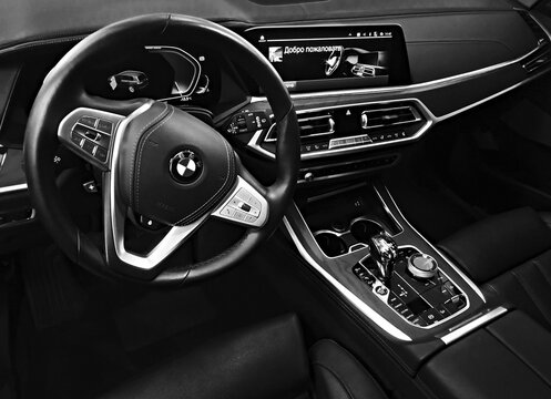 BIYSK, Russia- MAY 20, 2021: Luxury car interior BMW X7, 2021-with dashboard, clock, media system, front seats and shift gear.