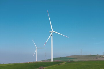 Wind turbine and windmill. Clean energy in green nature in different locations. Sustainability and environment concept  © Bigy