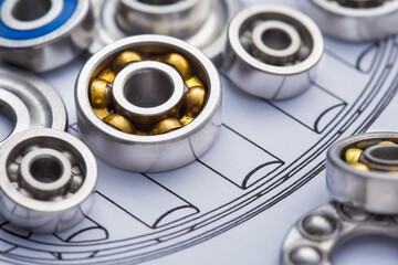 bearings of different types, micrometer, caliper and ruler on the drawings of technical products. Technologies and engineering.