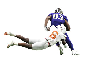 Young athletic football players making amazing plays during a competitive game