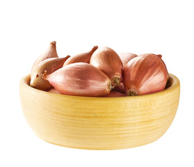 onions shallots in a wooden bowl isolated on wooden background.