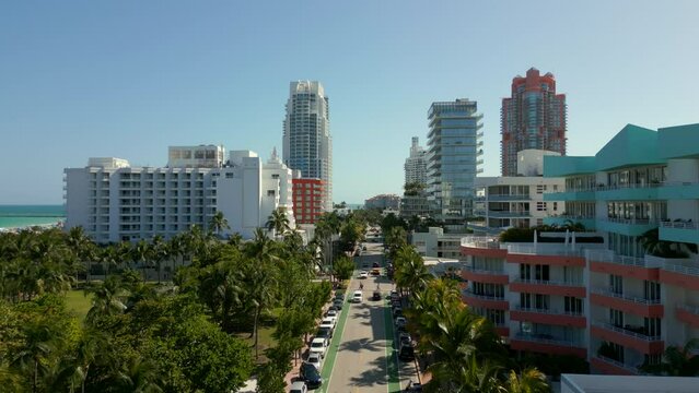 Aerial rise reveal Miami South Beach Ocean Drive facing south towards inlet and highrise condominiums