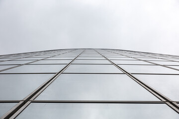 Reflections of clouds on glass and metal building