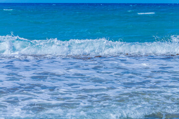Fototapeta premium Sea waves with foam off the coast of a tropical island