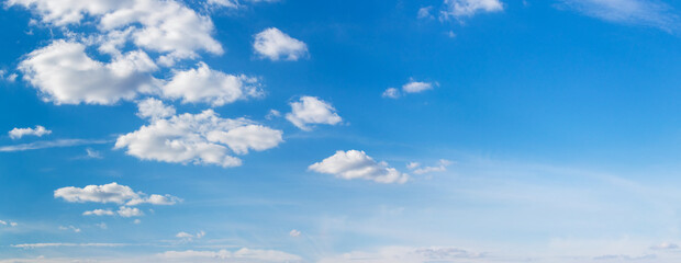 Blue sky with small white cumulus clouds, copy space