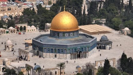 Al Aqsa golden dome of the rock Aerial view, Jerusalem

Drone view from the old city of Jerusalem, 4K, march, 2023 
