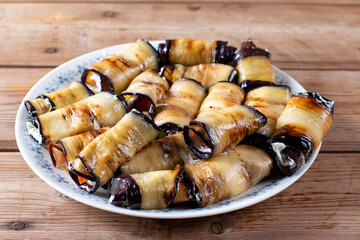 Fried eggplant rolls with cheese on a table. Georgian cuisine.