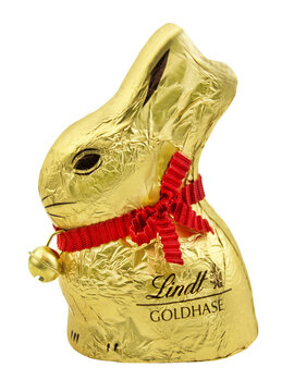 Goldener Osterhase aus Schokolade von Lindt und Hintergrund transparent PNG cut out