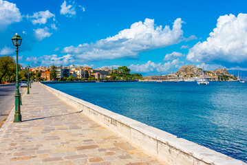 View of the Palaio Frourio at the far end of waterfront promenade at Greek island Corfu © dudlajzov