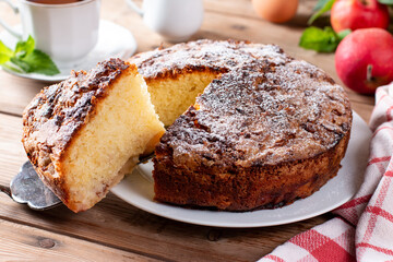 Sponge cake or chiffon cake with apples, so soft and delicious with ingredients on table. Homemade...