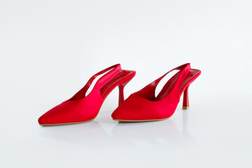 Stylish red high-heeled shoes, beautiful women shoes with heels on white studio background, professional photoshoot