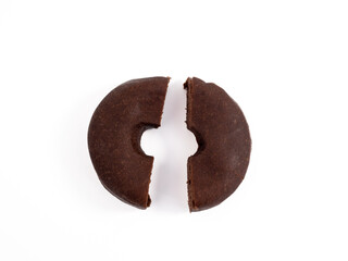 Dark vegetarian donut isolated on white background. Close-up.