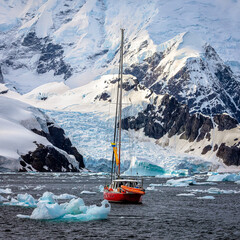 Fototapeta premium Impressive iceberg with blue ice and beautiful reflection on water in Antarctica, scenic landscape in Antarctic Peninsula 