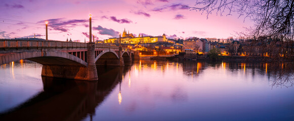 Prague nightscape with the city skyline, landmark buildings, old town towers, and Charles Bridge over the Vltava River Czech Republic