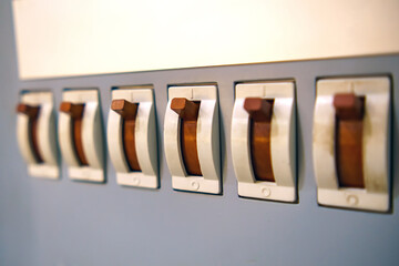 A range of automatic fuses are in the on position