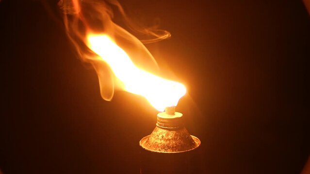 Night view of an old kerosene | oil | gas lamp, the wick of which is burning during the Mexican Temazcal ritual.