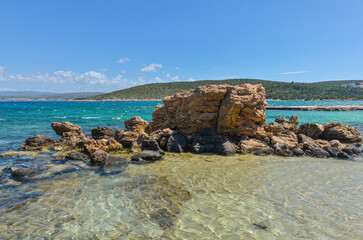 rocks and crystal clear water on Dodo Beach in Ardic (Cesme, Izmir region, Turkey) © ssmalomuzh