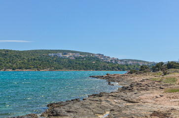 scenic view of turquoise water and coastal rocks of Pasa bay from Dodo beach in Ardic (Cesme, Izmir region, Turkey)