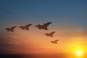 Air Force Day. Aircraft silhouettes on background of sunset.