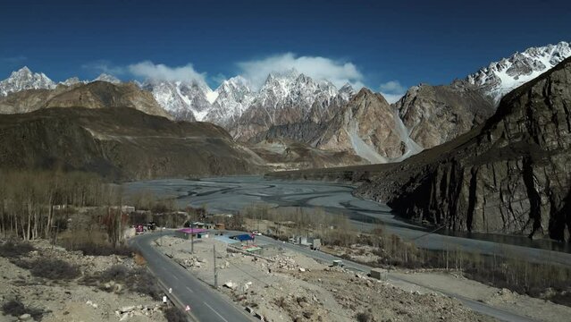 Aerial Backward shot of Passu Cones and Karakoram Highway. Aerial View of  of Hunza Valley.