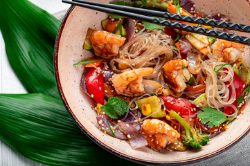 Rice noodles with shrimp and vegetables. Asian cuisine.