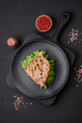 Delicious sandwich with crispy toast, chicken, tomatoes and lettuce