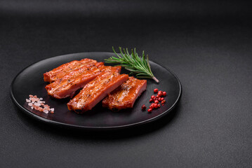 Grilled fresh juicy ribs with salt, spices and herbs