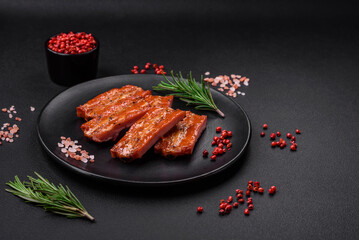 Grilled fresh juicy ribs with salt, spices and herbs