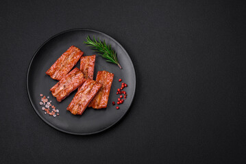 Grilled fresh juicy ribs with salt, spices and herbs