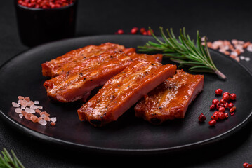 Grilled fresh juicy ribs with salt, spices and herbs