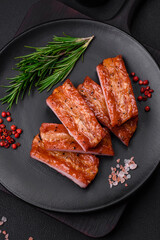 Grilled fresh juicy ribs with salt, spices and herbs