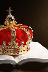 A Gold Crown with Red Velevet on a Bible