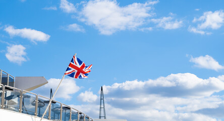 britain flag waving in blue sky background