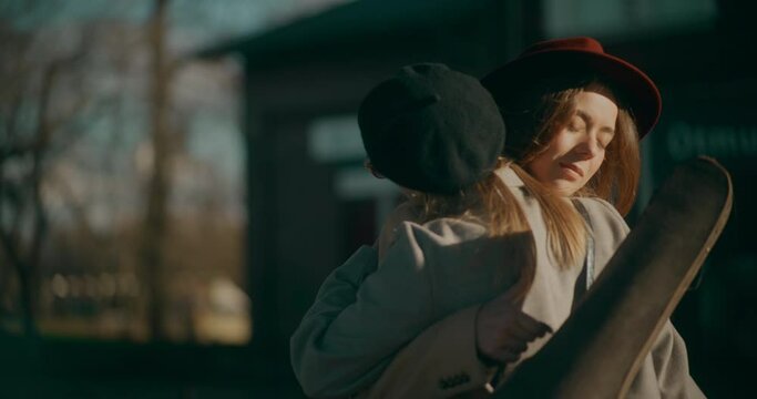 Two Women Talking at Railway Station