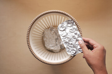 medical blister pack dropping in a bin 