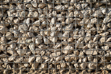 Fence made of steel and small stones as a decoration