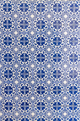 Traditional hand painted azulejos ceramic tiles decorating a building in Portugal.